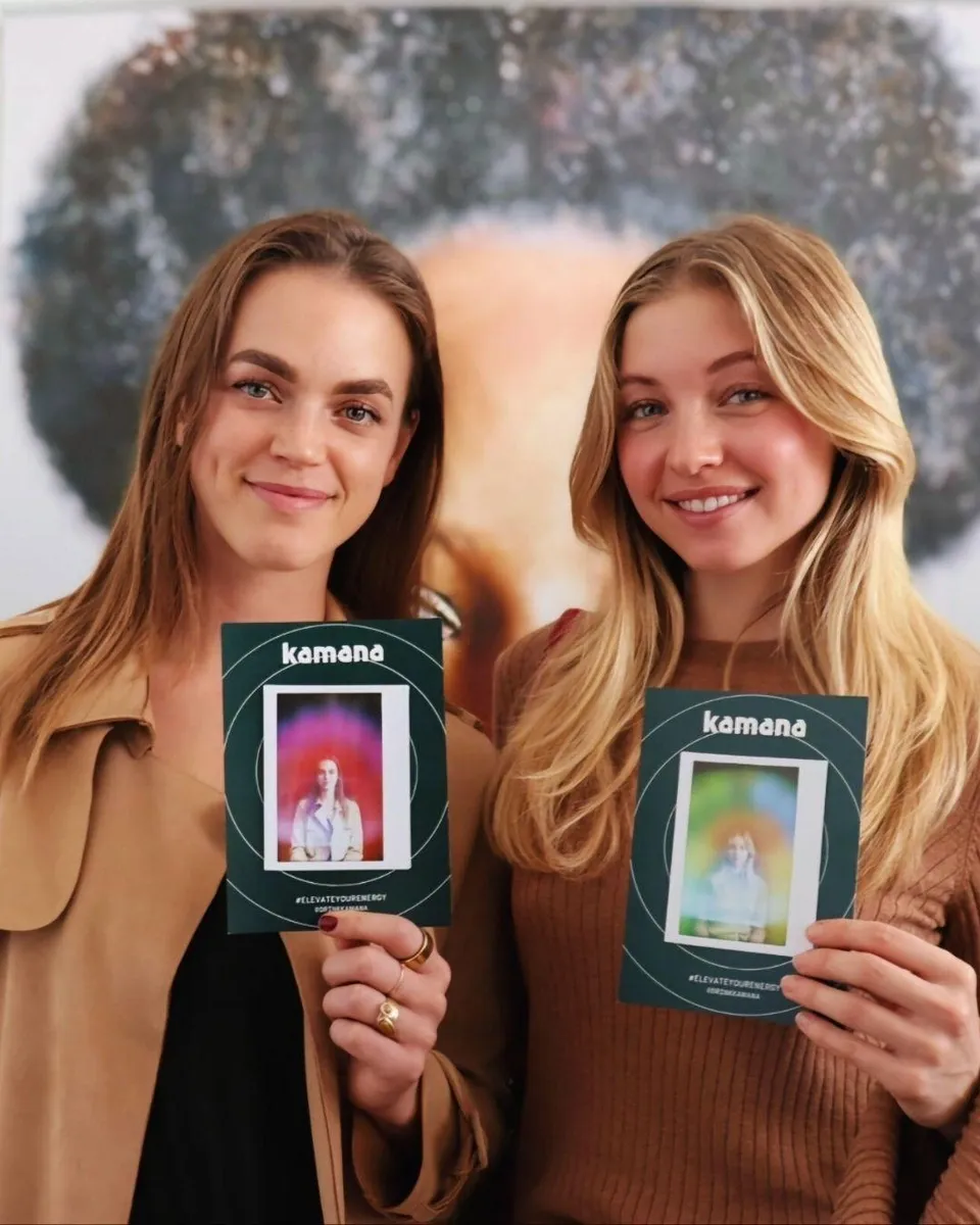 Two girls are holding aura photos